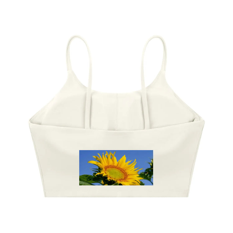 Spaghetti Strap Yoga Sports Bra featuring a sunflower graphic design on a white crop top.