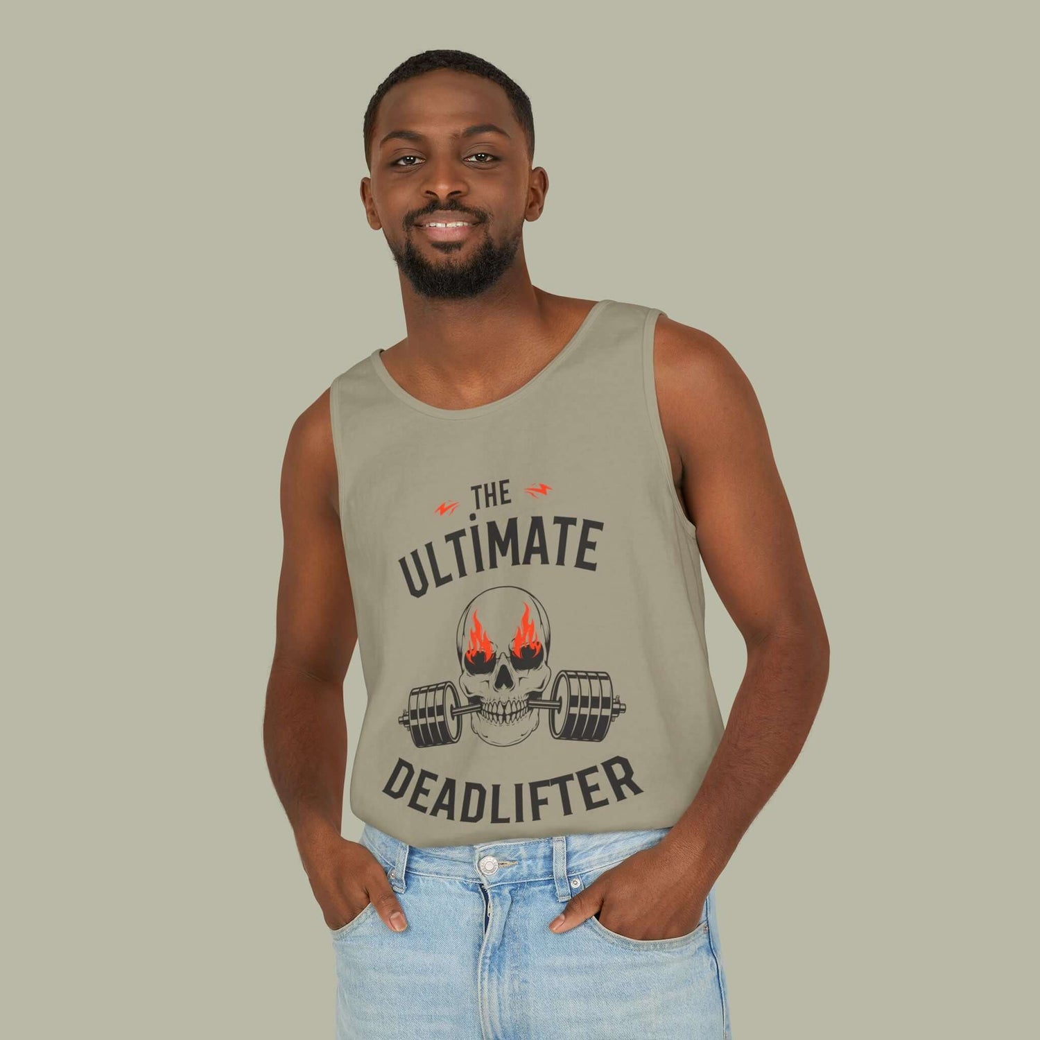 Man wearing the ultimate deadlifter gym tank top featuring a skull and barbell graphic.