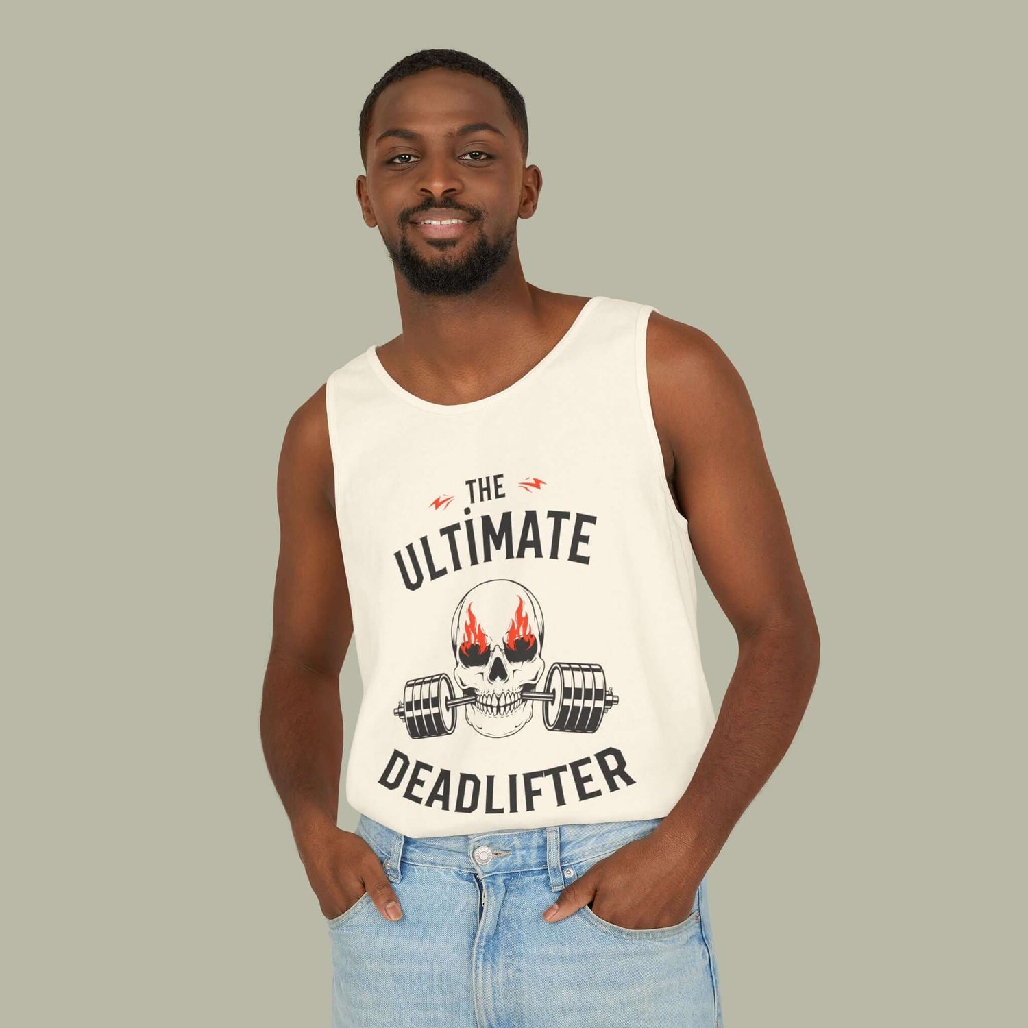 Man wearing the ultimate deadlifter gym tank top with skull-and-barbell graphic in a relaxed fit.