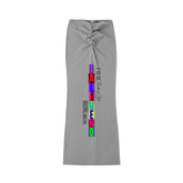Dyed Washed Drawstring Maxi Skirt featuring a ruched design and colorful text on a gray fabric.