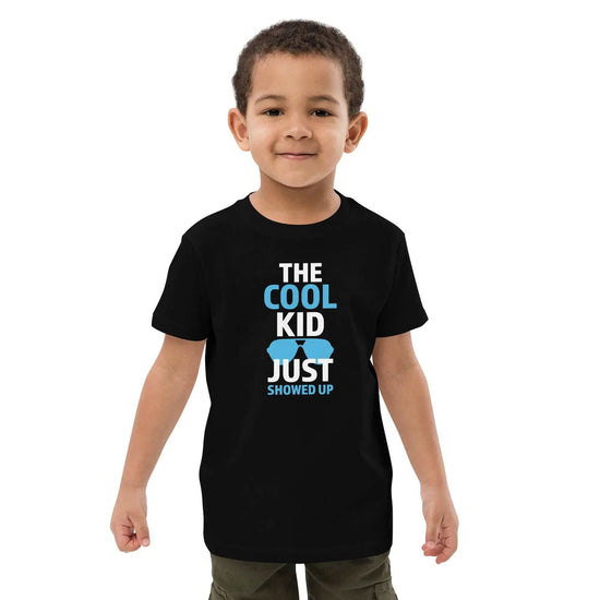 Cool Kid JustThe Cool Kid Just Showed Up T-shirtIntroducing "The Cool Kid Just Showed Up" T-shirt – the perfect blend of style, comfort, and sustainability for your little trendsetter! Crafted from 100% organic ri[Bal]