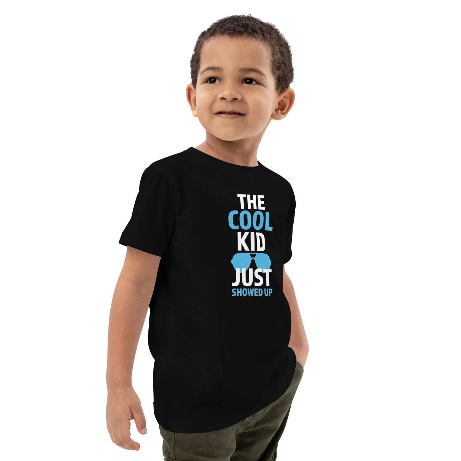 Cool Kid JustThe Cool Kid Just Showed Up T-shirtIntroducing "The Cool Kid Just Showed Up" T-shirt – the perfect blend of style, comfort, and sustainability for your little trendsetter! Crafted from 100% organic ri[Bal]
