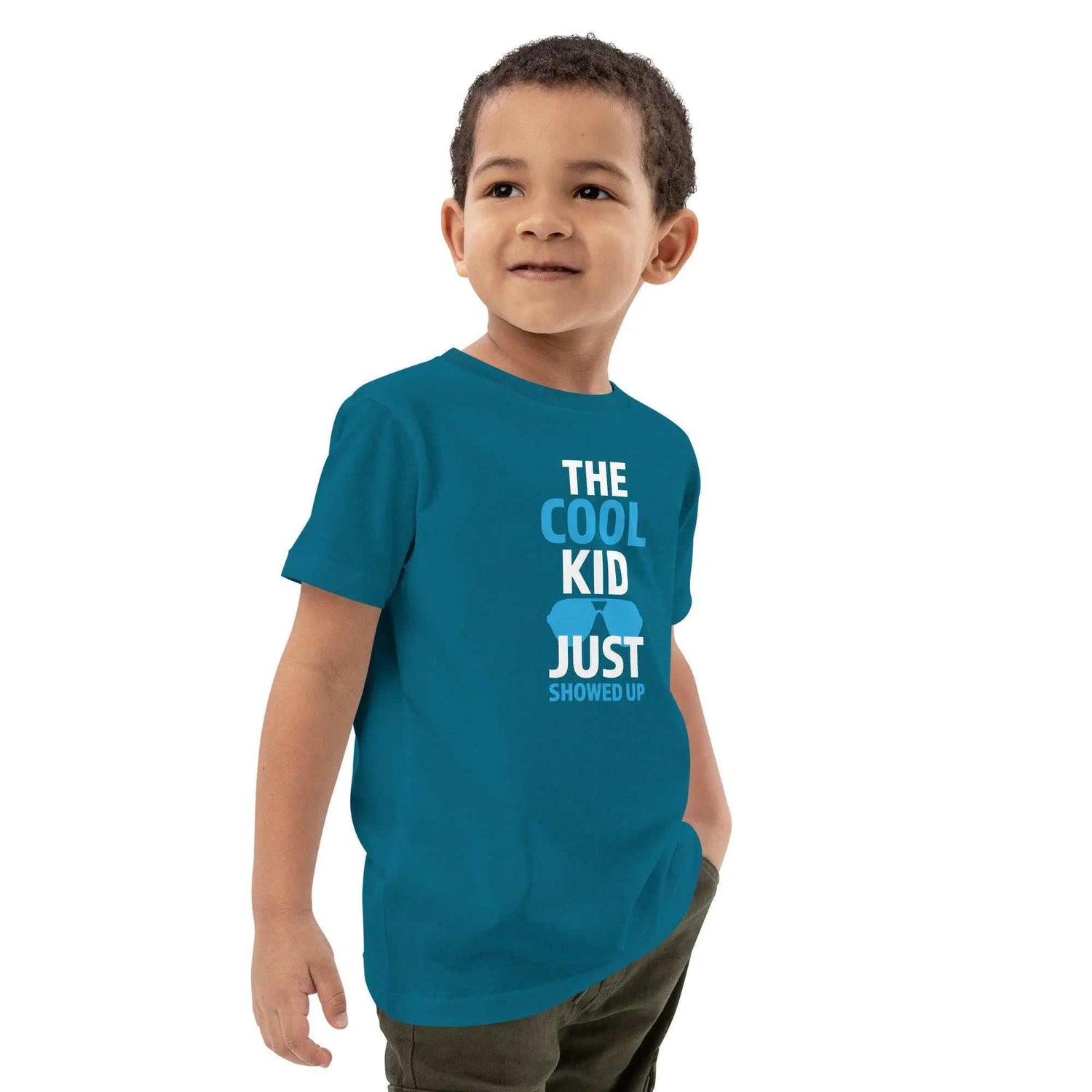 Cool Kid JustThe Cool Kid Just Showed Up T-shirtIntroducing "The Cool Kid Just Showed Up" T-shirt – the perfect blend of style, comfort, and sustainability for your little trendsetter! Crafted from 100% organic ri[Bal]