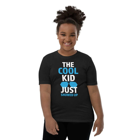 The Cool KidThe Cool Kid Just Showed Up T-ShirtIntroducing "The Cool Kid Just Showed Up" T-shirt – the perfect blend of style, comfort, and sustainability for your little trendsetter! Crafted from 100% organic ri[Bal]