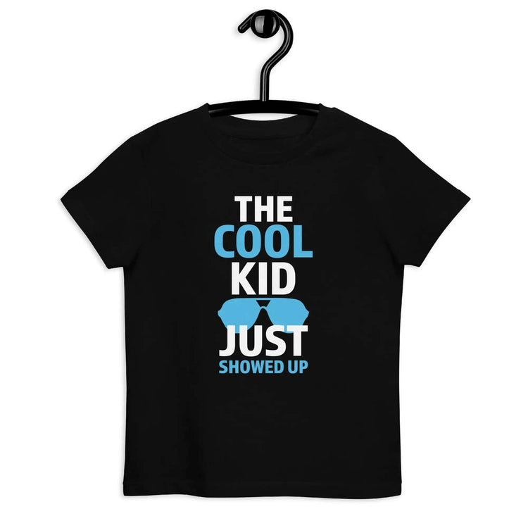 The Cool KidThe Cool Kid Just Showed Up T-shirtIntroducing "The Cool Kid Just Showed Up" T-shirt – the perfect blend of style, comfort, and sustainability for your little trendsetter! Crafted from 100% organic ri[Bal]