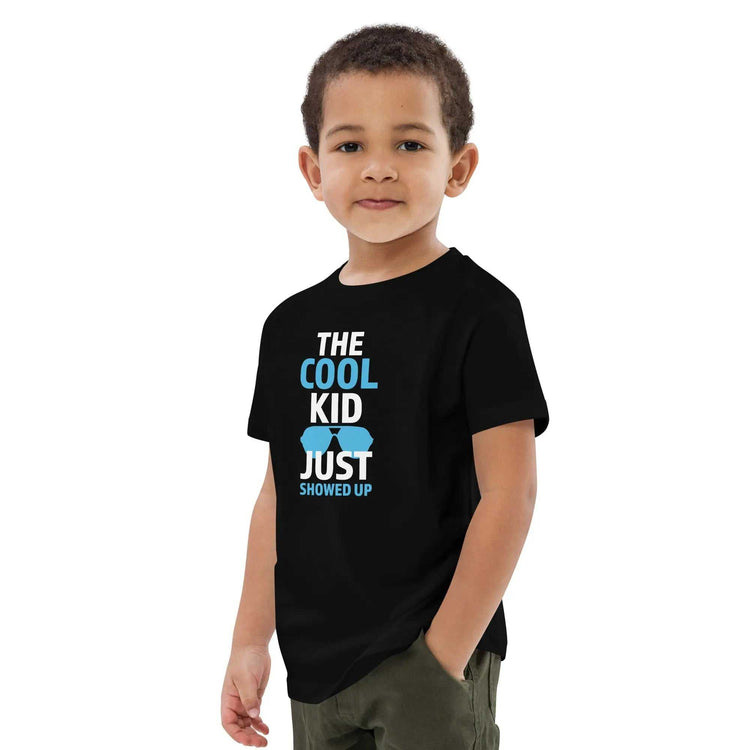Cool Kid JustThe Cool Kid Just Showed Up T-shirtIntroducing "The Cool Kid Just Showed Up" T-shirt – the perfect blend of style, comfort, and sustainability for your little trendsetter! Crafted from 100% organic ri[Bal]