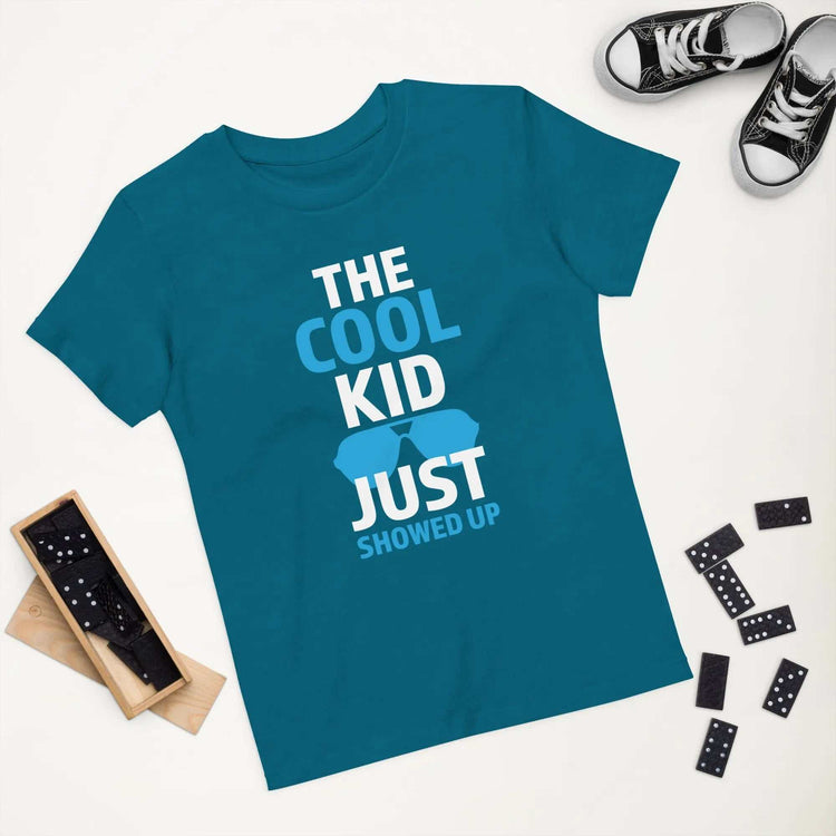 The Cool KidThe Cool Kid Just Showed Up T-shirtIntroducing "The Cool Kid Just Showed Up" T-shirt – the perfect blend of style, comfort, and sustainability for your little trendsetter! Crafted from 100% organic ri[Bal]